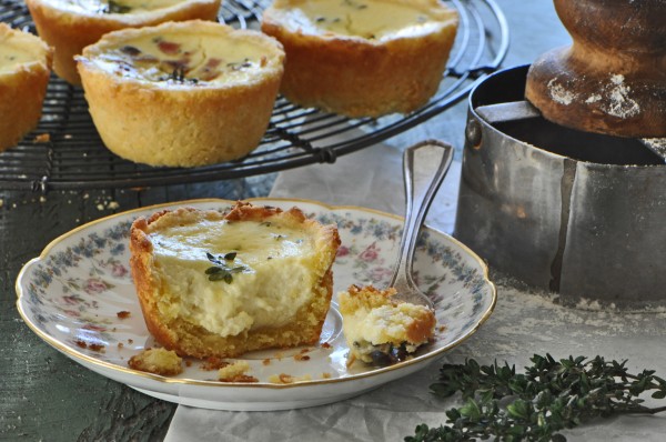 "Delicious thyme scented, custard filled, cornmeal crusted tarts."