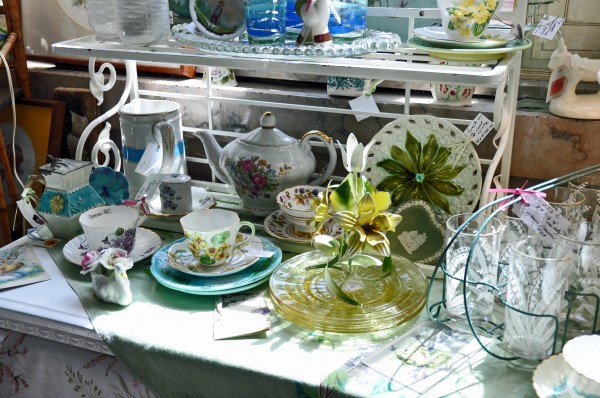 "A table of vintage and antique collectibles"