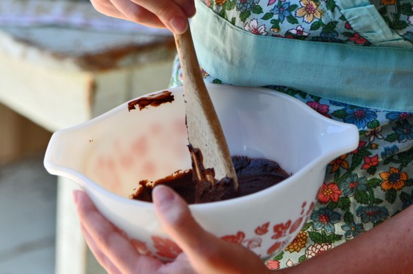 "Stirring rich chocolate glaze for a Chocolate Snack Cake Recipe"
